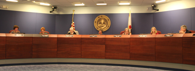 The Sarasota County School Board sits in session on Sept. 15 with board attorney Art Hardy at the far right. Chairman Frank Kovach is at the center of the dais. Photo by Rachel Hackney