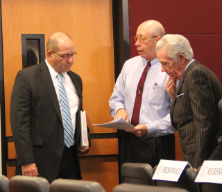 Tom Harmer, Tom Barwin and Doug Logan talk informally before the start of the Nov. 6 special meeting. File photo