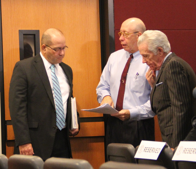 Tom Harmer, Tom Barwin and Doug Logan talk informally before the start of the Nov. 6 special meeting. Rachel Hackney photo
