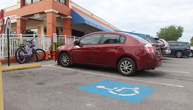 A handicapped parking sign is missing from one Key Corners space. Rachel Hackney photo