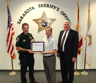 Col. Kurt Hoffman of the Sheriff’s Office accepts the Seven Seals Award from ESGR committee members Tony Conboy and David McCormick. Contributed photo