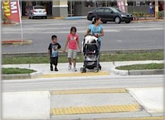 Refuge islands are designed to make it safer for pedestrians to cross busy roads. Image courtesy FDOT