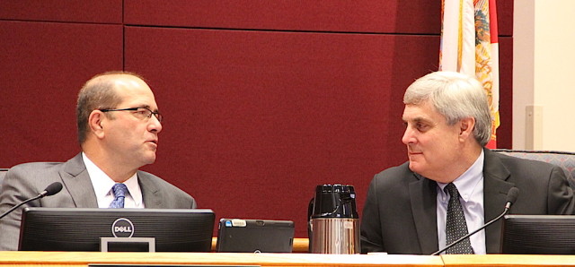 County Administrator Tom Harmer talks with County Attorney Stephen DeMarsh. Rachel Hackney photo