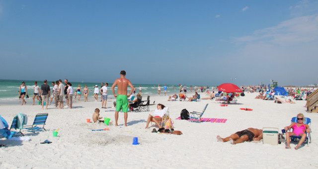 Tourists make themselves at home on Siesta Public Beach. File photo