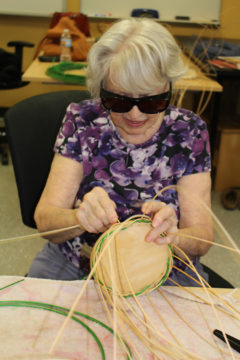Bona Lee enjoys the Basket Weaving for the Visually Impaired class offered by Adult and Community Enrichment. Contributed photo