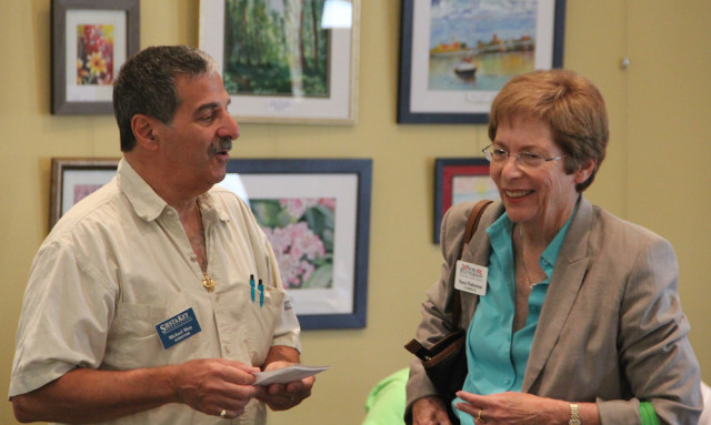 Siesta Key Association President Michael Shay talks with former County Commissioner Nora Patterson on April 7. Rachel Hackney photo