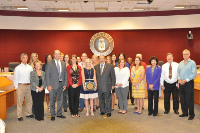 The Sarasota County commissioners congratulate staff for the award. Image courtesy Sarasota County