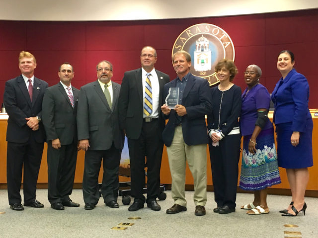 The county commissioners, County Administrator Tom Harmer and Parks, Recreation and Natural Resources Director Carolyn Brown congratulate George Tatge on May 24. Photo courtesy of Drew Winchester, Sarasota County