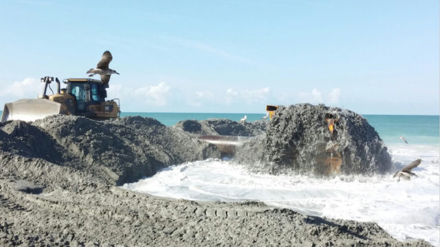 Sand piped ashore was moved into place by bulldozers. Image courtesy Sarasota County