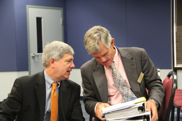 Art Hardy (left) talks with consultant Bill Vogel after the discussion with the School Board. Rachel Hackney photo