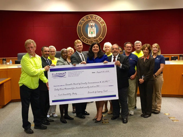 Members of Friends of The Legacy Trail and Friends of Sarasota County Parks join the County Commission for the check presentation. Photo courtesy Sarasota County