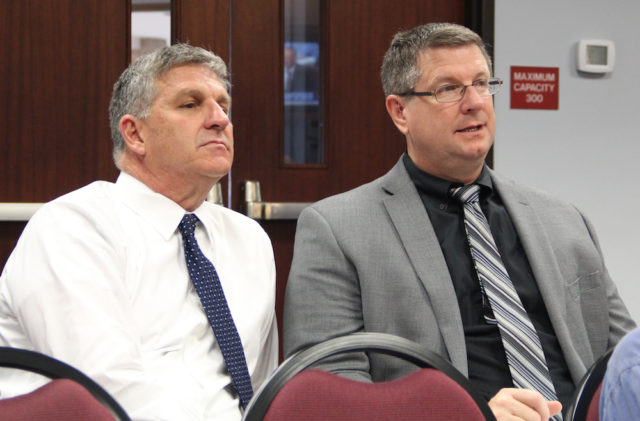 Steve Cantees (left), the district's executive director of high schools, and Sarasota High Principal David Jones listen to discussion on Oct. 18. Rachel Hackney photo