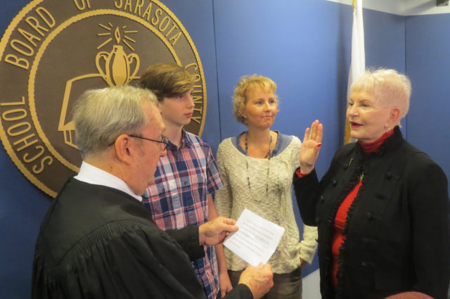 Caroline Zucker (right) is sworn in by retired Judge Lee Haworth. Joining her are grandson Colin Leonard and daughter Liza Leonard. Contributed photo